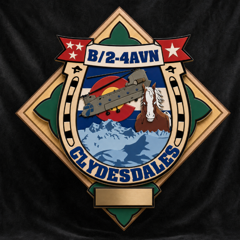A large engraved military-style insignia patch on a black fabric background. The patch is diamond-shaped with a horseshoe motif, reading 'B/2-4AVN' at the top and 'GLYDESDALES' at the bottom, with a helicopter, mountains, horse, and Colorado state flag imagery in the center.