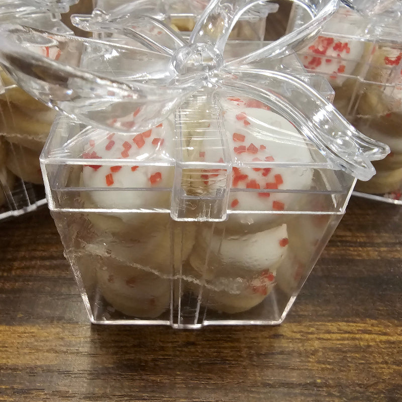 Clear plastic packaging containing small round sugar cookies