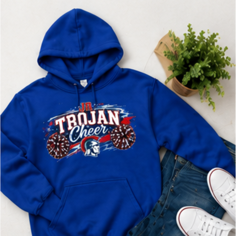 A royal blue hoodie with a 'Trojan Cheer' graphic on the chest, styled in a flat lay with blue jeans, white sneakers, and a small potted plant on a light beige background.