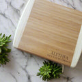 Two wooden cutting boards with engraved text on a wooden surface