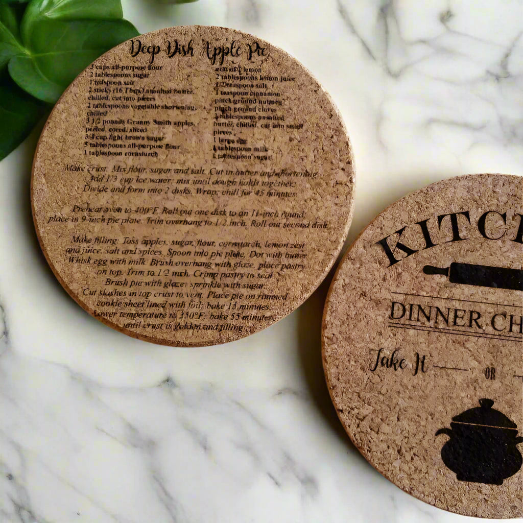 Two cork coasters with text and graphics on a white surface