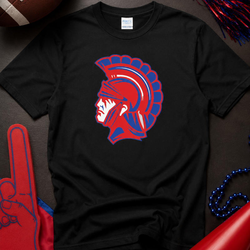 A black short-sleeve t-shirt with a red and blue Spartan helmet graphic on the chest, styled in a patriotic flat-lay with a football, pom-poms, a foam finger, and a megaphone.