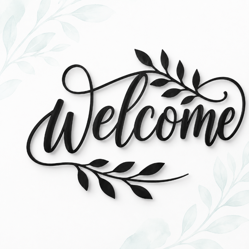 Black acrylic wall art featuring the word 'Welcome' in elegant cursive script, decorated with leafy branches, shown on a white background.