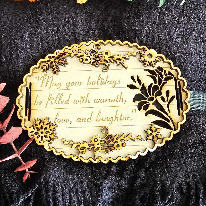 Decorative gold and black ornament with text on a textured dark background